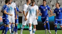Sklonjene glave slovenskih reprezentantov po tekmi  na Cipru.