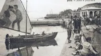 Na največ izolskih razglednicah je   pristanišče, mandrač z Velikim 
trgom ali Porto Apollo. Na jadru ribiške barke  pred  “carinskim 
pomolom”   mož  reže ženi  jezik.   