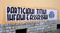 Transparent na stavbi Prosvetnega doma na Opčinah.