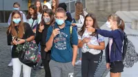 V šolski torbi tudi maska