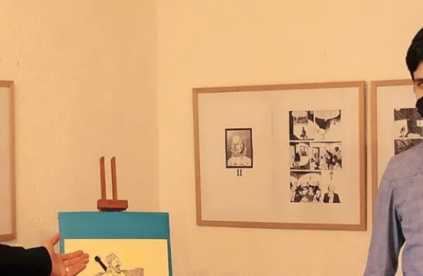 Martin Ramoveš (desno) z Miho Eričem v galeriji Salsaverde, kjer 
je na ogled njegov Ivan Rob.