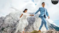 Ena od nagrajenih fotografij: Bosonoga nevesta in ženin med 
poročnim fotografiranjem v objemu gora (Julijske Alpe, Slovenija).