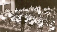 Vladimir Lovec je med drugim v Glasbeni šoli Koper vodil  simfonični orkester, ki je zdaj poimenovan  po 
njem. Fotografija je nastala leta 1958 v Gledališču Koper ob 10. obletnici ustanovitve glasbene šole. 