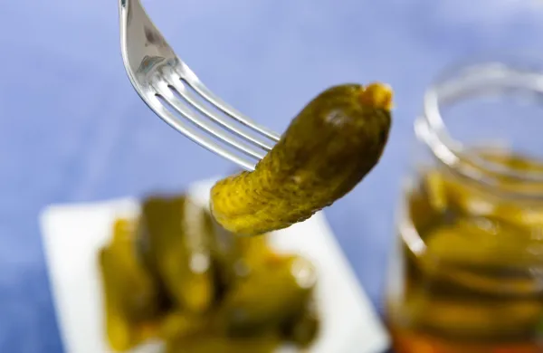 Green pickled cucumber impaled with fork. Marinated appetizer.,Image: 1021324489, License: Royalty-free, Restrictions:, Model Release: no, Credit line: Iakov Filimonov/Alamy/Profimedia