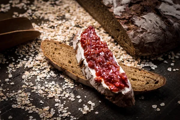 Fruity Jam on Traditional Whole Grain Rye Bread on Dark Wooden Table Background,Image: 340564296, License: Royalty-free, Restrictions:, Model Release: no, Credit line: Victority/Alamy/Profimedia