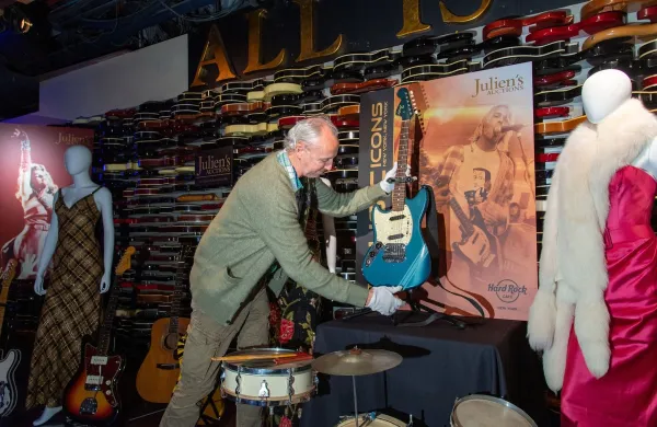 The blue 1969 Mustang Fender guitar used by rock icon Kurt Cobain in the 1991 Nirvana music video 'Smells Like Teen Spirit' is displayed by Julien's Auctions CFO Martin Nolan at the media preview of the 'Music Icons' auction at the Hard Rock Cafe on May 16, 2022 in New York.Julien's Auctions Music Icons Press Preview at Hard Rock Cafe, New York, USA - 16 May 2022,Image: 691894128, License: Rights-managed, Restrictions:, Model Release: no, Credit line: Erik Pendzich/Shutterstock Editorial/Profimedia