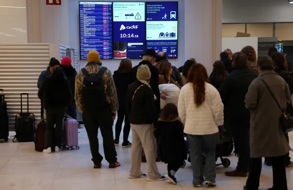 Commuters look at time table at Madrid's Chamartin train station, on February 9, 2026, amid a national strike by Spanish train drivers' union to demand railway safety measures following deadly accidents, in Adamuz and in Gelida. The sign reads 'If there were no more trains?'. Spanish train drivers began a three-day strike, demanding greater safety for their profession after two accidents claimed 47 lives last month, leaving thousands of passengers stranded.,Image: 1073384687, License: Rights-managed, Restrictions:, Model Release: no, Credit line: Pierre-Philippe MARCOU/AFP/Profimedia