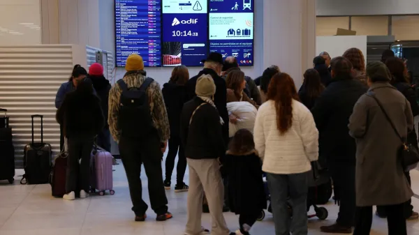 Commuters look at time table at Madrid's Chamartin train station, on February 9, 2026, amid a national strike by Spanish train drivers' union to demand railway safety measures following deadly accidents, in Adamuz and in Gelida. The sign reads 'If there were no more trains?'. Spanish train drivers began a three-day strike, demanding greater safety for their profession after two accidents claimed 47 lives last month, leaving thousands of passengers stranded.,Image: 1073384687, License: Rights-managed, Restrictions:, Model Release: no, Credit line: Pierre-Philippe MARCOU/AFP/Profimedia