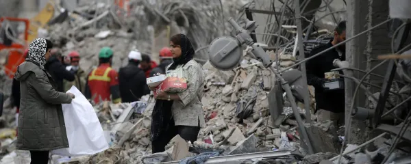 TEHRAN, IRAN &acirc;&euro;" MARCH 12: Residents carry belongings through the rubble of a damaged building near Risalat Square following Israeli and US strikes that caused heavy destruction in eastern Tehran, Iran on March 12, 2026. At least 40 people were reported killed in the attacks. Fatemeh Bahrami/Anadolu,Image: 1082310181, License: Rights-managed, Restrictions:, Model Release: no, Credit line: Fatemeh Bahrami/AFP/Profimedia