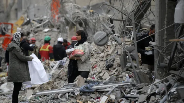 TEHRAN, IRAN &acirc;&euro;" MARCH 12: Residents carry belongings through the rubble of a damaged building near Risalat Square following Israeli and US strikes that caused heavy destruction in eastern Tehran, Iran on March 12, 2026. At least 40 people were reported killed in the attacks. Fatemeh Bahrami/Anadolu,Image: 1082310181, License: Rights-managed, Restrictions:, Model Release: no, Credit line: Fatemeh Bahrami/AFP/Profimedia