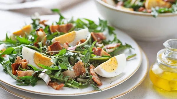 Dandelion salad with eggs and bacon close up,Image: 1012949825, License: Royalty-free, Restrictions:, Model Release: no, Credit line: zidi, Panther Media Global/Alamy/Profimedia