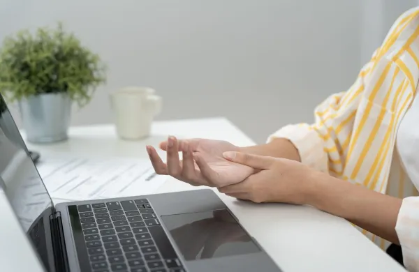 Asian young woman working in office with a carpal tunnel syndrome or wrist joint inflammation, hand muscle inflammation from office syndrome, hand muscle pain from working,Image: 1050663225, License: Royalty-free, Restrictions:, Model Release: no, Credit line: chaiyan Anuwatmongkonchai/Alamy/Profimedia