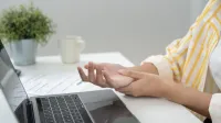 Asian young woman working in office with a carpal tunnel syndrome or wrist joint inflammation, hand muscle inflammation from office syndrome, hand muscle pain from working,Image: 1050663225, License: Royalty-free, Restrictions:, Model Release: no, Credit line: chaiyan Anuwatmongkonchai/Alamy/Profimedia