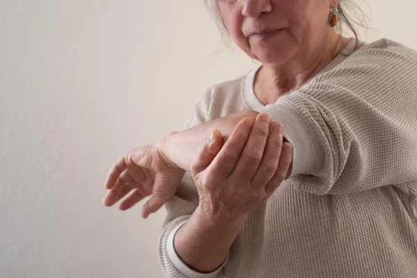 Elderly European Woman Suffering from Joint Pain, for Example in the Elbow. High quality photo,Image: 1019554867, License: Royalty-free, Restrictions:, Model Release: no, Credit line: Victor Koldunov/Alamy/Profimedia
