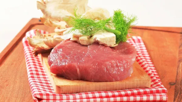 Raw red meat and oyster mushrooms on a cutting board,Image: 225730191, License: Rights-managed, Restrictions:, Model Release: no, Credit line: -/Digifoodstock/Profimedia